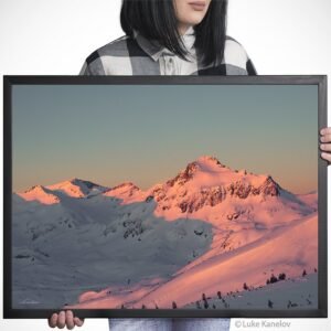 Winter sunset over a snow covered mountain